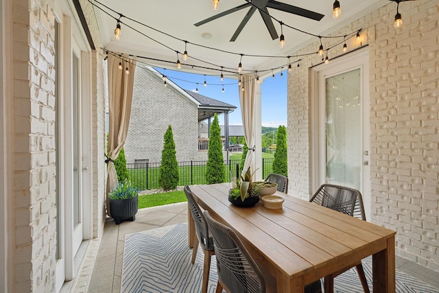 7020 Vineyard Valley Dr, College Grove, TN 37046 - sunroom / solarium with brick wall, a ceiling fan, outdoor dining space, tile patterned floors, and crown molding