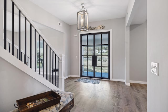 7609 Nolensville Rd, Nolensville, TN 37135 - foyer entrance with french doors, stairway, wood finished floors, and baseboards
