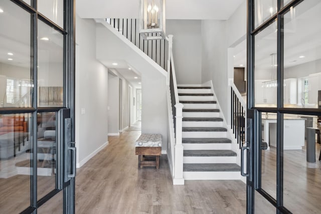 7609 Nolensville Rd, Nolensville, TN 37135 - interior space with light wood-type flooring, baseboards, stairway, and a high ceiling