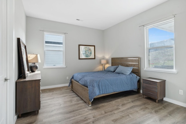 7609 Nolensville Rd, Nolensville, TN 37135 - bedroom with light wood-type flooring, visible vents, and baseboards