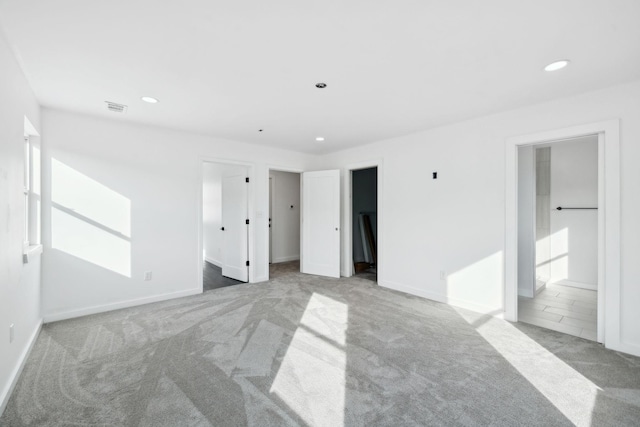 7609 Nolensville Rd, Nolensville, TN 37135 - unfurnished bedroom with recessed lighting, visible vents, baseboards, and light colored carpet