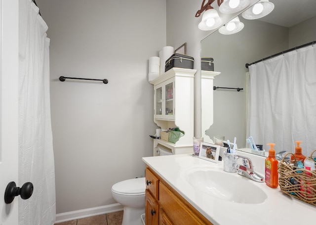 full bathroom featuring toilet, baseboards, vanity, and tile patterned floors