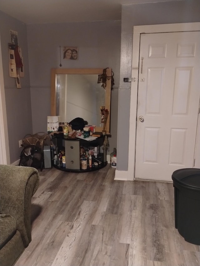 entryway with wood finished floors