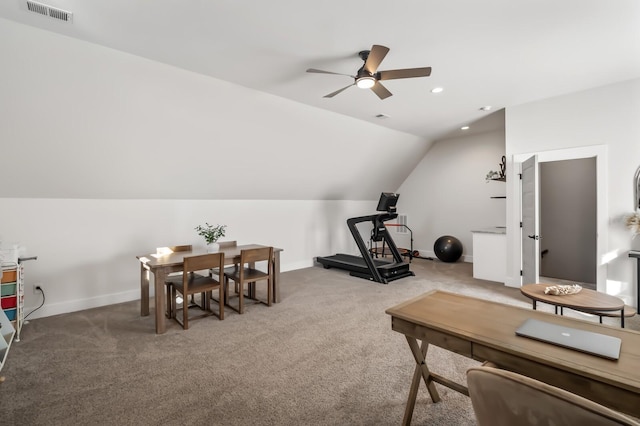 exercise area featuring vaulted ceiling, carpet flooring, visible vents, and baseboards