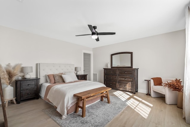 bedroom with light wood-style flooring and ceiling fan