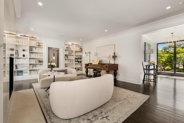 313 Deerwood Ln, Brentwood, TN 37027 - living area with baseboards, dark wood-style flooring, crown molding, a chandelier, and built in shelves