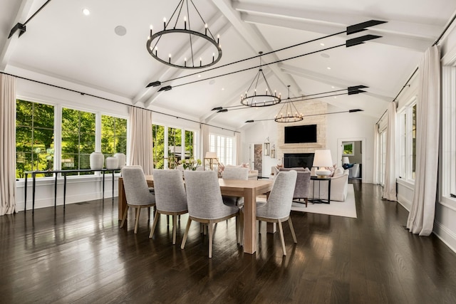 313 Deerwood Ln, Brentwood, TN 37027 - dining space with a chandelier, a large fireplace, beam ceiling, recessed lighting, and dark wood-style flooring