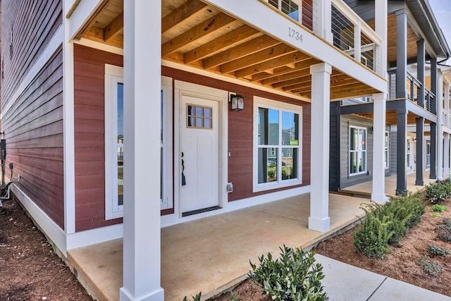 entrance to property featuring covered porch