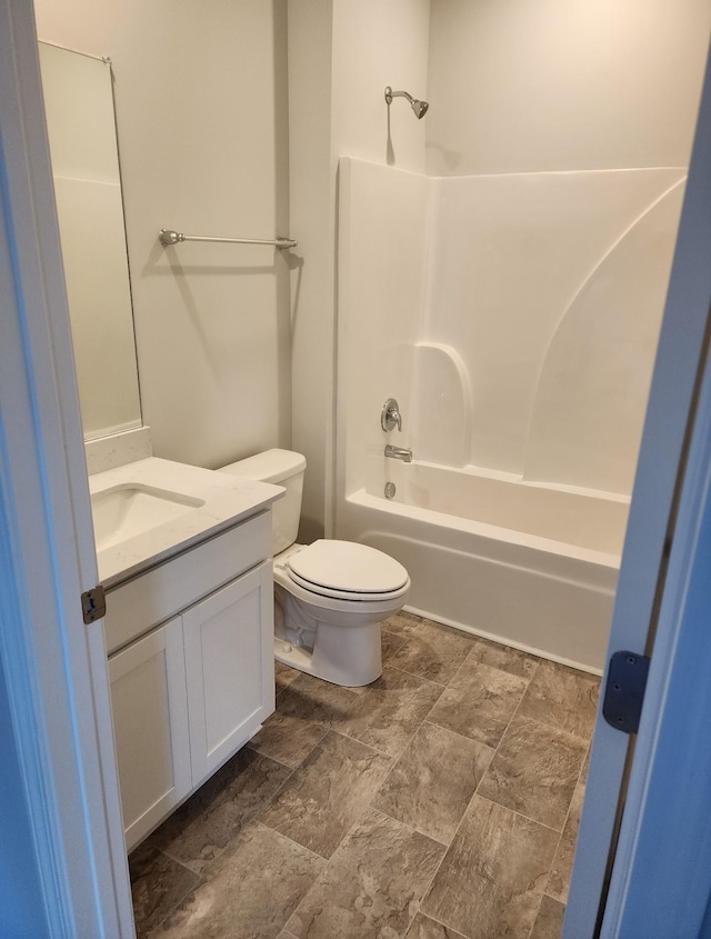 full bath featuring shower / bath combination, vanity, and toilet