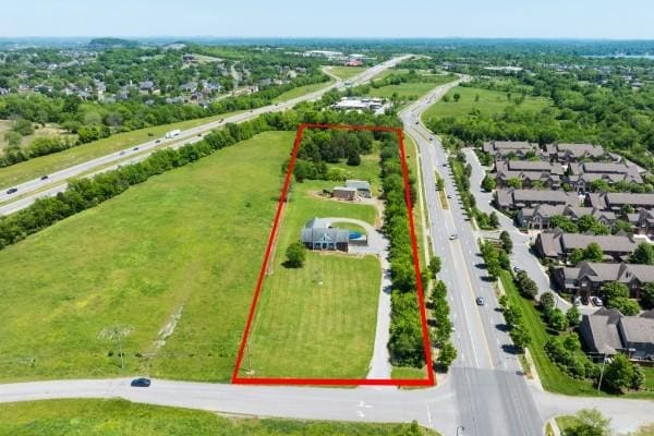 birds eye view of property with a residential view