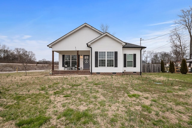 view of front of property featuring a porch, a front yard, crawl space, and fence