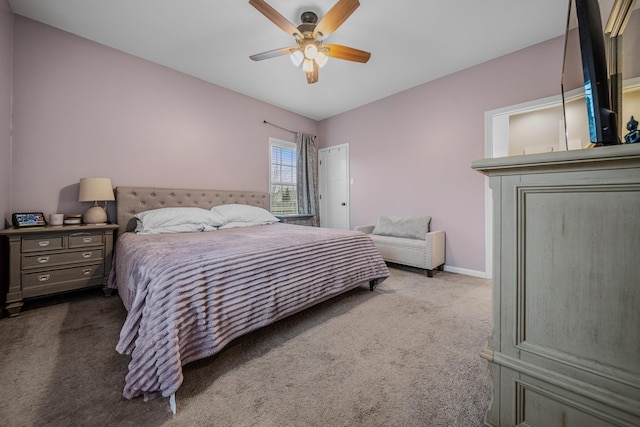 bedroom with carpet floors, a ceiling fan, and baseboards