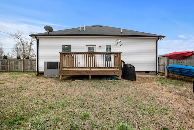 back of property with crawl space, a yard, a fenced backyard, and a wooden deck