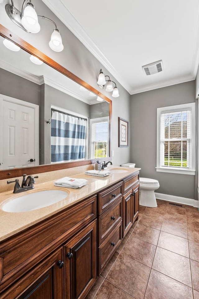 full bathroom with double vanity, visible vents, a sink, and ornamental molding