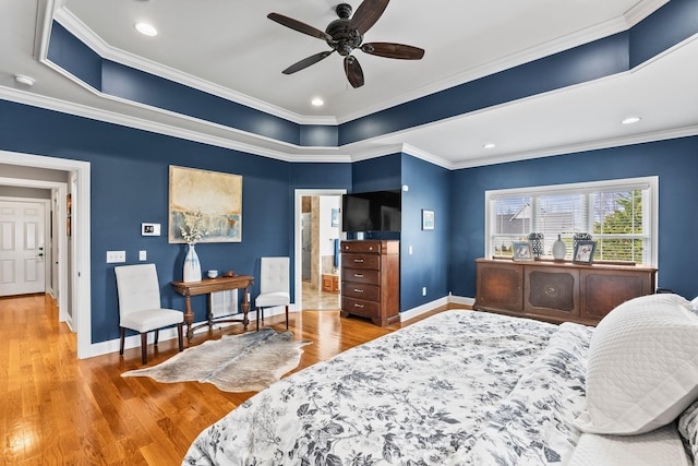 bedroom featuring baseboards, ornamental molding, and light wood-style floors