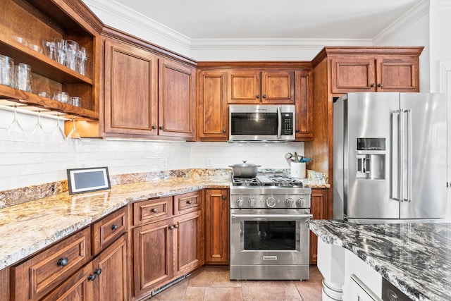 kitchen featuring light stone countertops, crown molding, brown cabinetry, and premium appliances