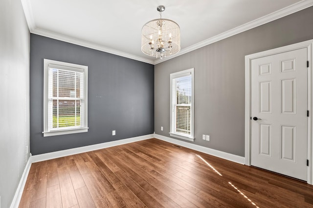 spare room featuring a healthy amount of sunlight, baseboards, and dark wood-style flooring