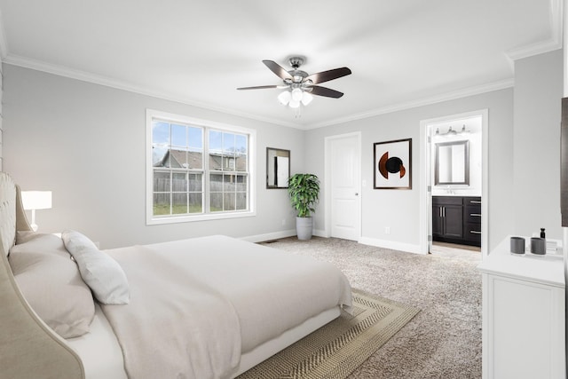 carpeted bedroom featuring ornamental molding, a ceiling fan, baseboards, and ensuite bathroom