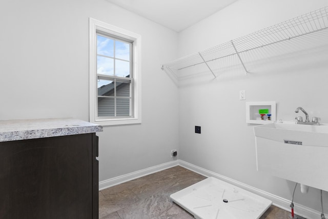 laundry room with washer hookup, a sink, electric dryer hookup, laundry area, and baseboards