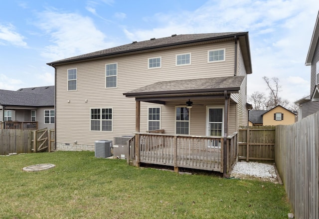 back of house with a deck, cooling unit, a fenced backyard, a yard, and a gate