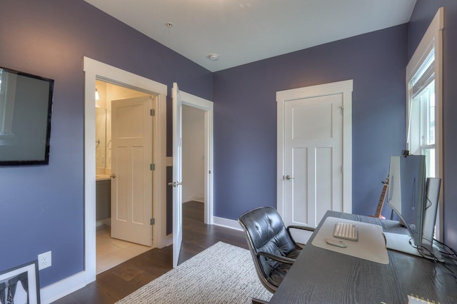 office area featuring wood finished floors and baseboards