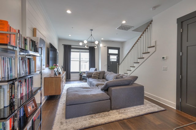 living area with visible vents, baseboards, stairway, recessed lighting, and hardwood / wood-style flooring