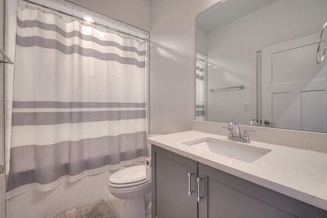 bathroom featuring vanity, toilet, and shower / tub combo with curtain