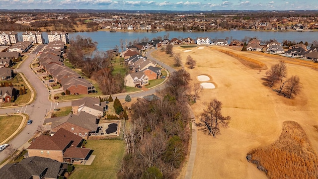 birds eye view of property with a water view and a residential view