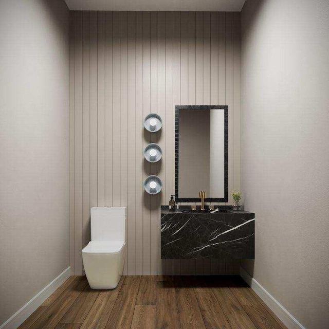 bathroom featuring baseboards and wood finished floors