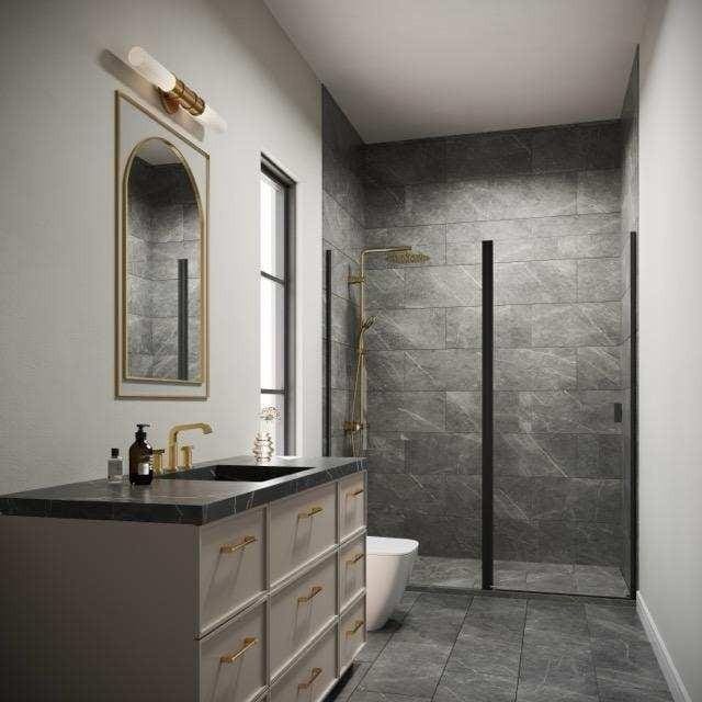 bathroom featuring baseboards, vanity, toilet, and walk in shower