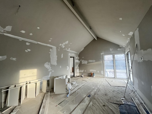 interior space featuring high vaulted ceiling and beamed ceiling