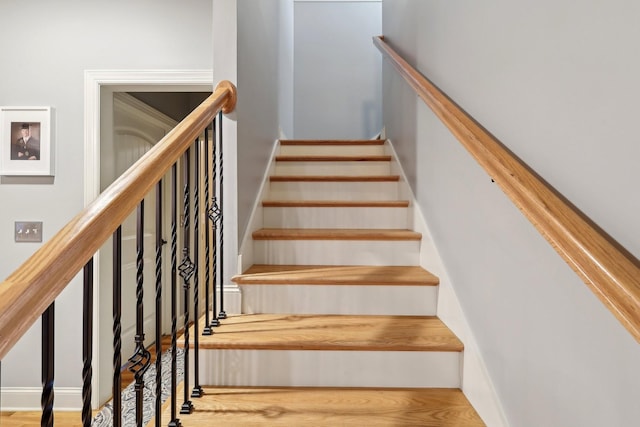 stairs with wood finished floors