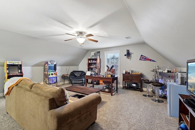 interior space with lofted ceiling, carpet flooring, ceiling fan, and baseboards