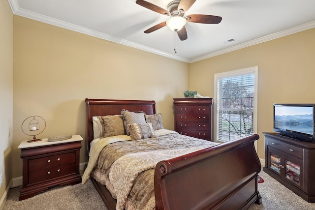 bedroom featuring visible vents, crown molding, and light colored carpet