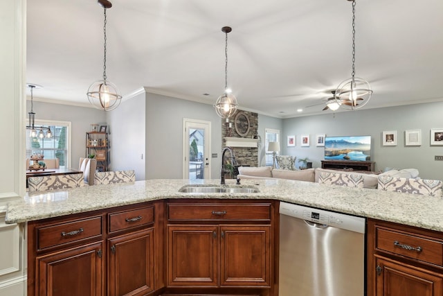 kitchen featuring dishwasher, open floor plan, a sink, and pendant lighting