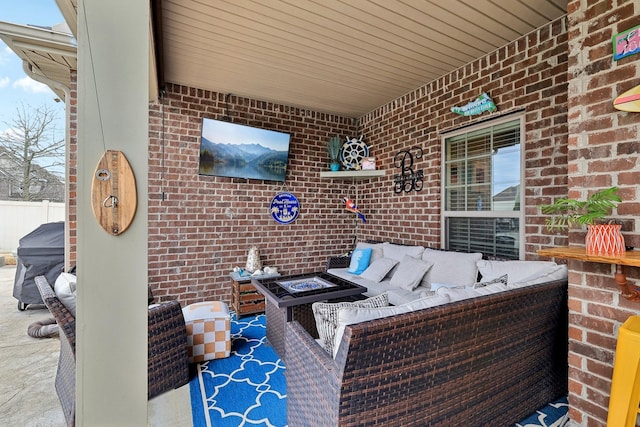 view of patio / terrace featuring an outdoor living space with a fire pit