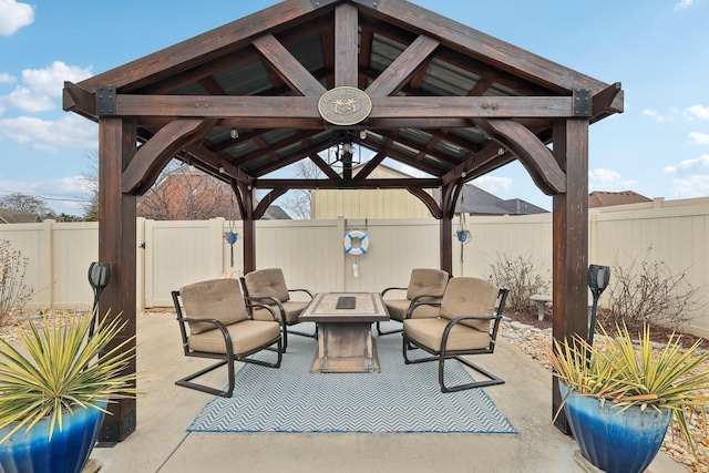 view of patio featuring a gazebo and a fenced backyard