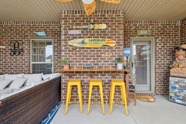 exterior space featuring outdoor dry bar and an outdoor hangout area