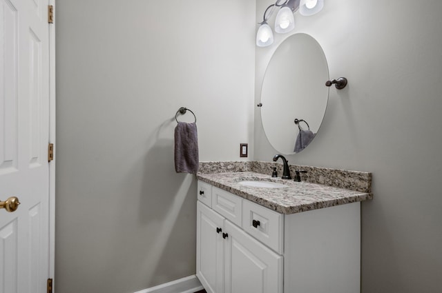 bathroom featuring vanity and baseboards