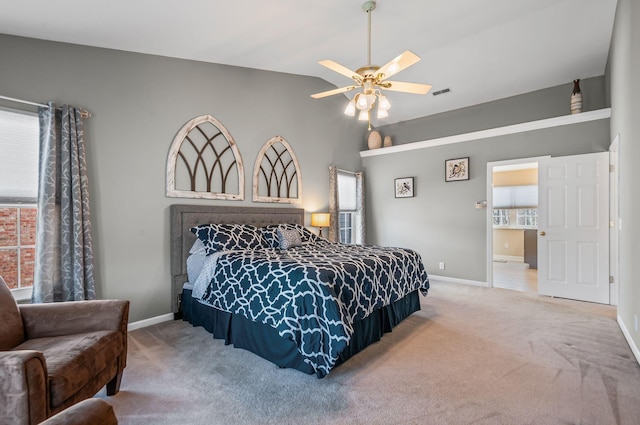 carpeted bedroom with vaulted ceiling, ceiling fan, visible vents, and baseboards