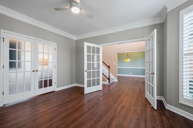 unfurnished room with baseboards, french doors, dark wood-style flooring, and crown molding