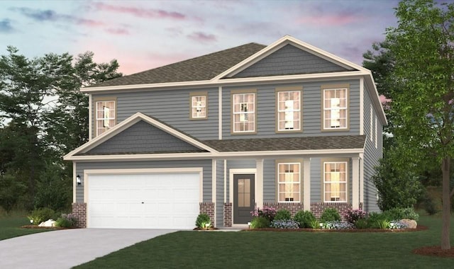 craftsman house featuring a garage, a yard, brick siding, and driveway