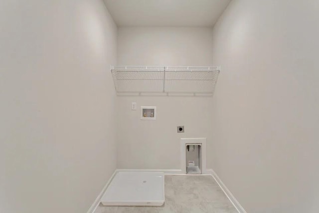 clothes washing area featuring baseboards, laundry area, hookup for a washing machine, and hookup for an electric dryer