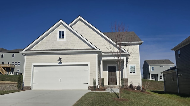 view of front of property featuring concrete driveway and a front lawn