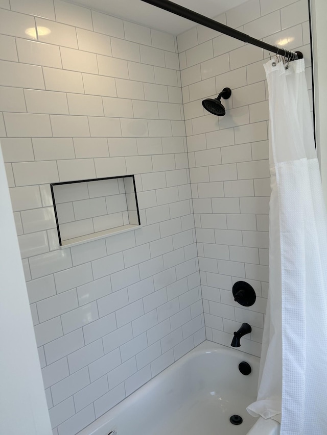 bathroom with shower / tub combo with curtain