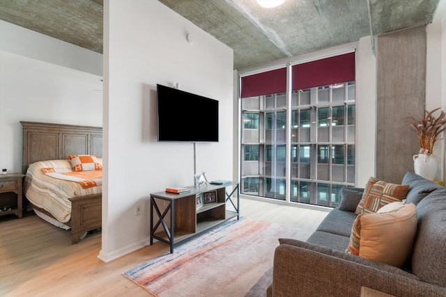 living area featuring expansive windows and wood finished floors