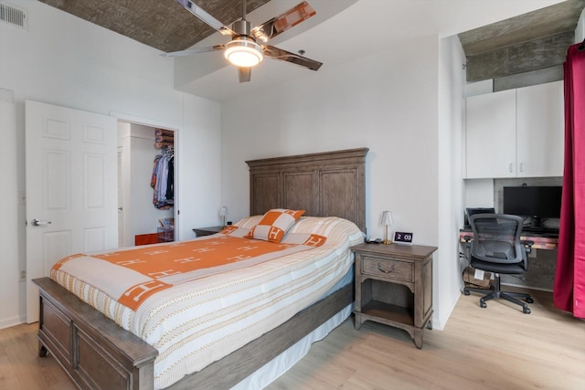 bedroom featuring ceiling fan, a closet, visible vents, and light wood-style floors