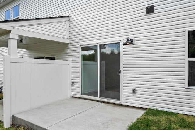 entrance to property with a patio area