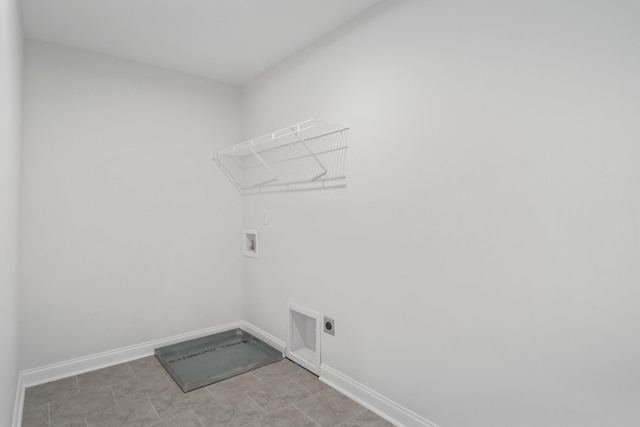 laundry room featuring baseboards, laundry area, hookup for a washing machine, and hookup for an electric dryer