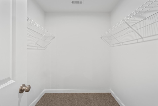 walk in closet with carpet and visible vents